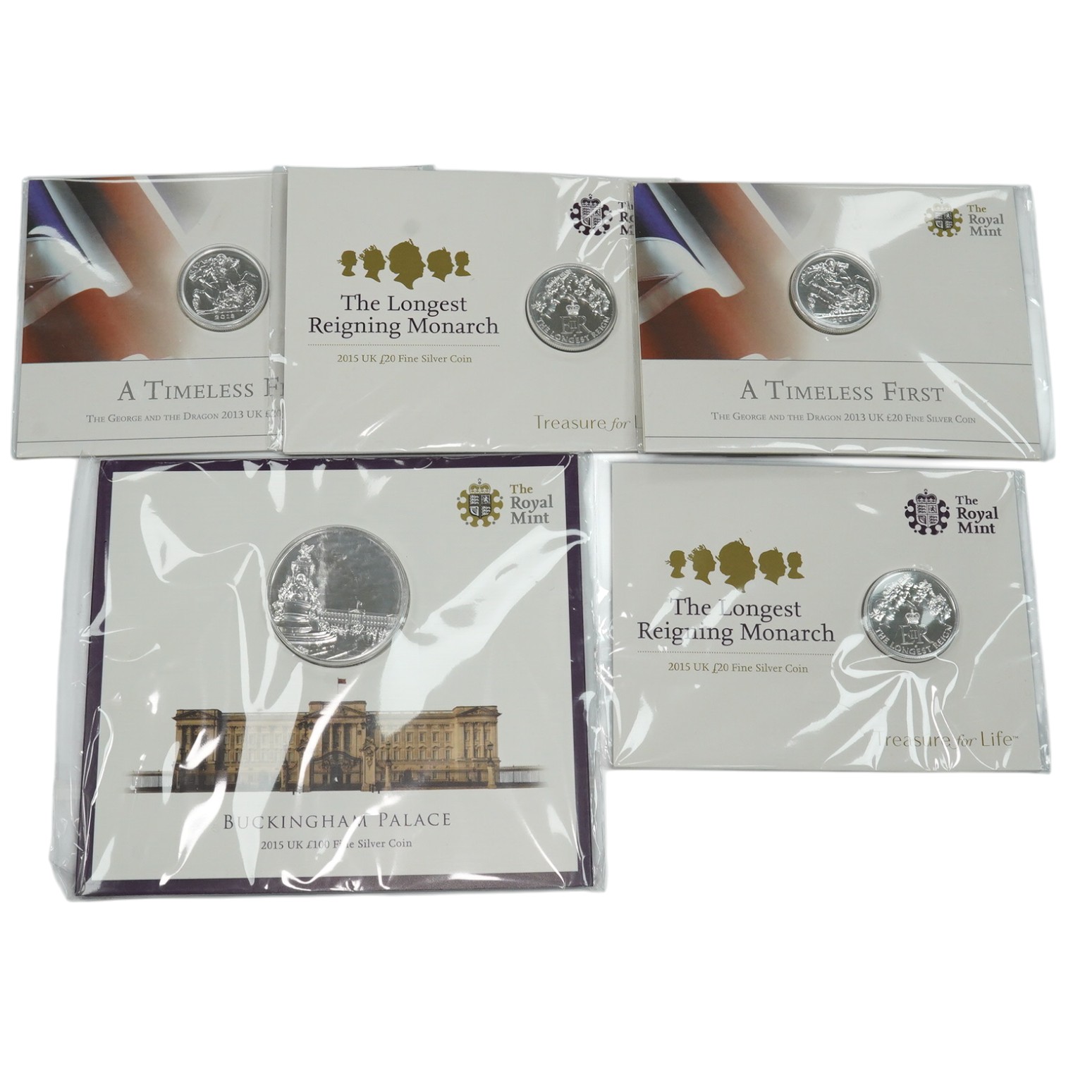 Royal Mint UK QEII coins, 2015 £100 fine silver coin, Buckingham Palace, two £20 fine silver coins, both 2013 and two £20 fine silver coins, both 2015 (5)